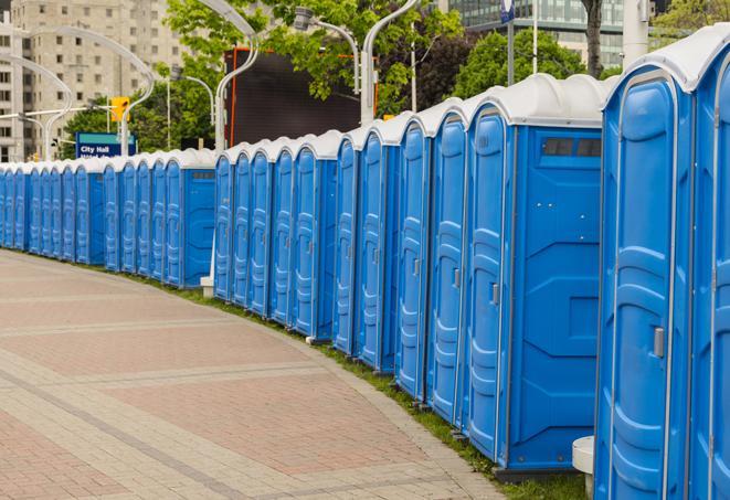 hygienic portable restrooms lined up at a beach party, ensuring guests have access to the necessary facilities while enjoying the sun and sand in Baker, LA